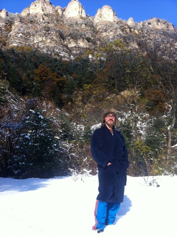 The boyf greeting the first snow in dressing gown and lumberjack hat.